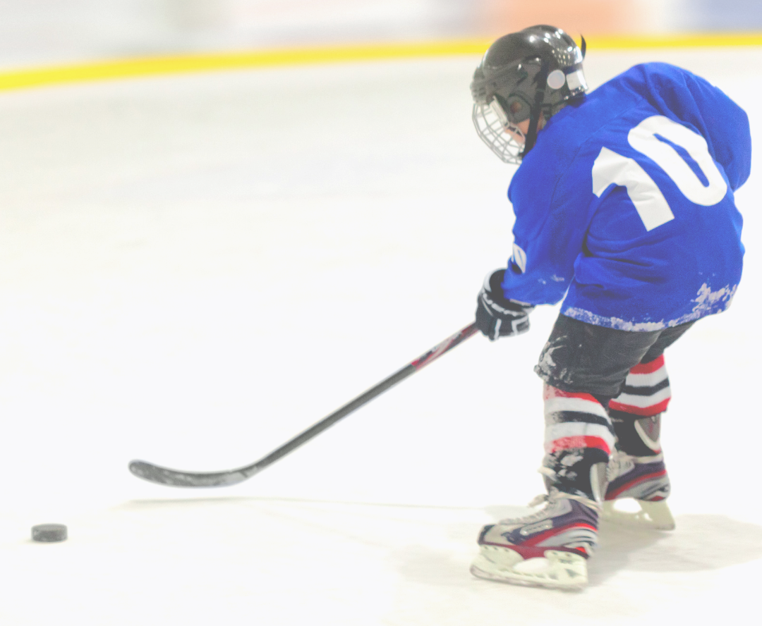 child playing ice hockey